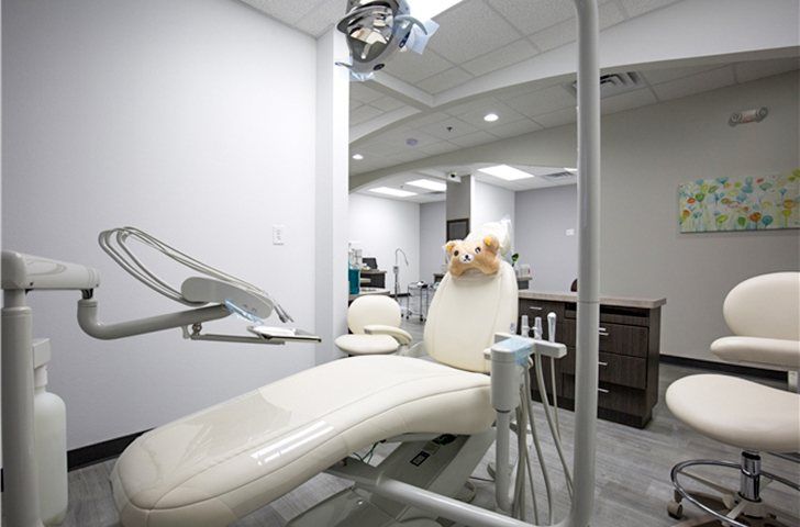 Dental exam chair with kids toy